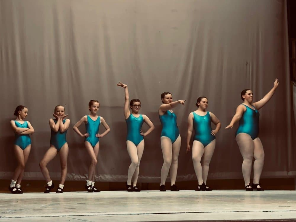 Musical theatre students in teal costume
