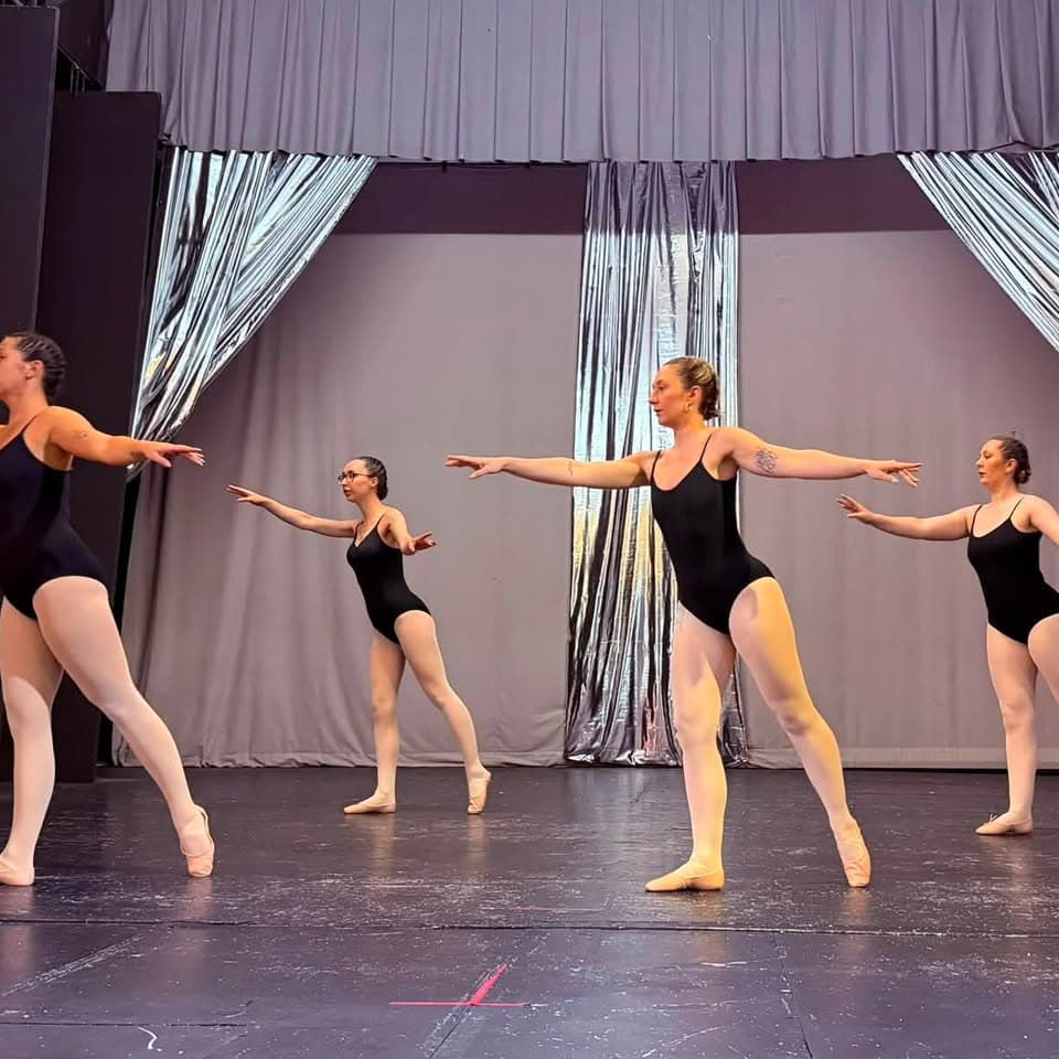 Four ballet dancers in a synchronised line